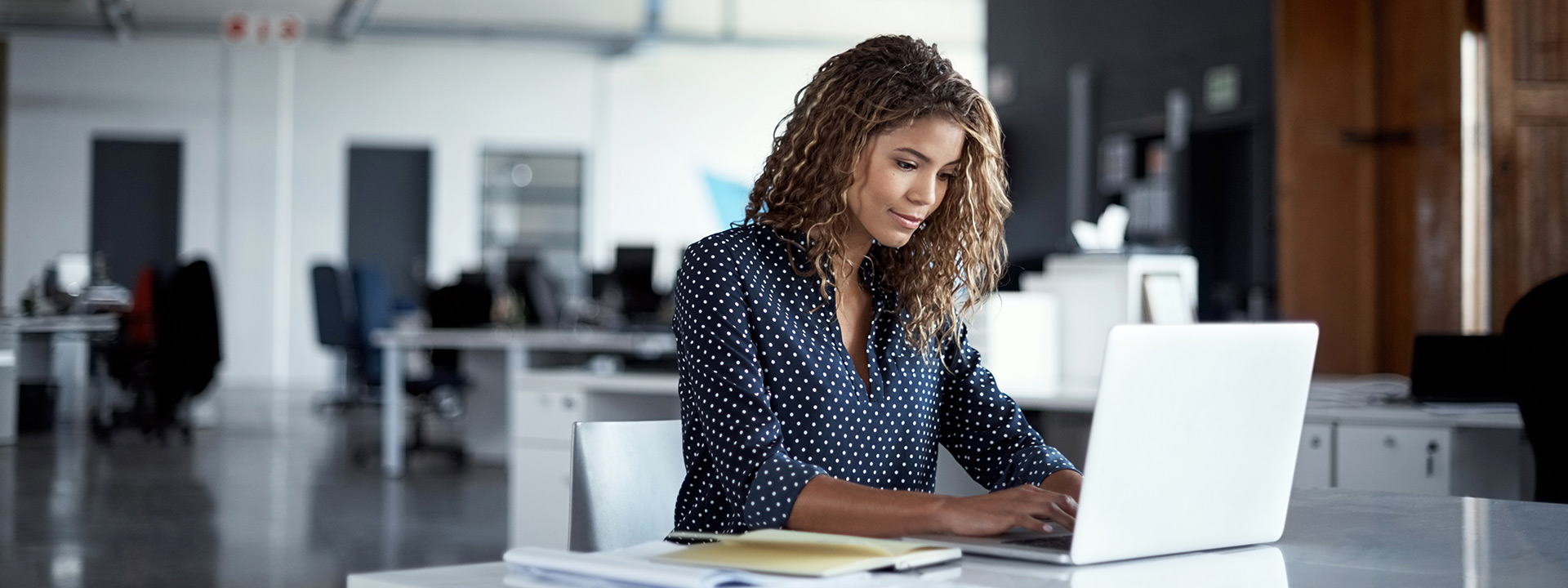 Woman looking at her laptop