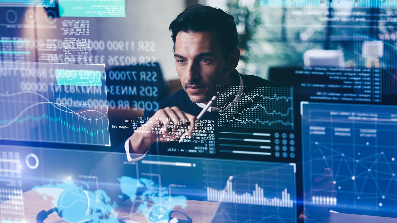 man looking at statistics on a screen